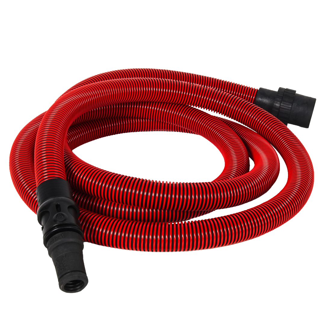 Operario utilizando el control remoto Bluetooth del aspirador en obra.